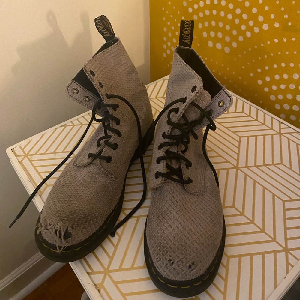 Unique Doc martens with a textured cloth fabric.